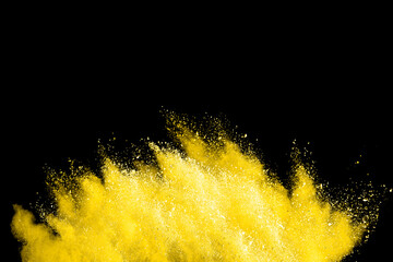 Wall Mural - explosion of colored powder isolated on black background.