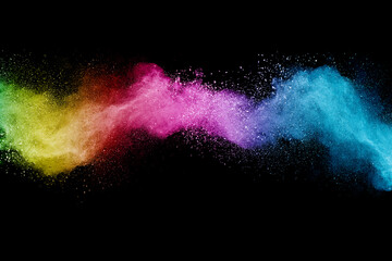 Wall Mural - abstract multicolor powder on black background. holi festival.