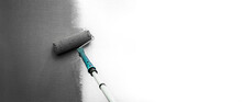 Close Up Roller With Gray Paint For Painting Walls. Repairs. White Wall. Background. Screensaver For The Site. High Quality Photo
