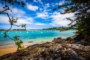 Small bay with boats at the emerald coast in Brittany, France