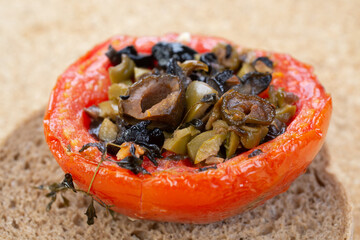 Roasted tomatoes stuffed with black and green olives