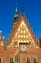 Wall Mural - Sightseeing of Wroclaw, Poland. City hall of Wroclaw - the monument of architecture in the Gothic style. Detail of the facade with an astonomical clock.