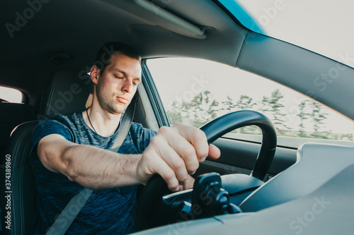 Fotomural Tired driver falls asleep while driving car