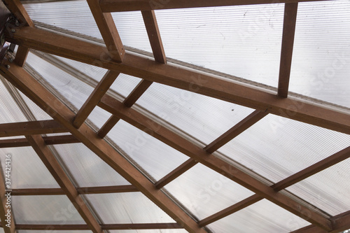 Cuadros en Lienzo closeup to a ceiling with joining wooden beams and transparent polycarbonate