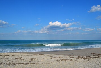 tropical beach with blue sky and clouds