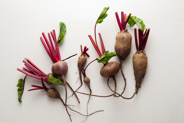 Wall Mural - Overhead view of Organic beetroots on stone surface