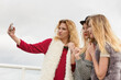 © anetlanda - Three women taking selfie outdoor
