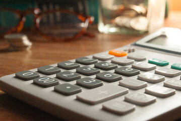 Financial accounting, money calculator on table