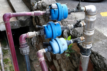 Individual water meters are installed on separate pipelines connected to the mains to be distributed to business premises or shops in the area.