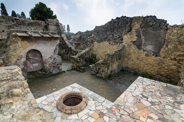 Wall Mural - Ruins of Herculaneum. The remains of a public kitchen where the inhabitants of Herculaneum cooked food. Herculaneum is famous for its eruption of Mount Vesuvius in AD 79. Herculaneum, Italy