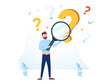 © Mykyta - Man holding magnifying glass and looking through it at interrogation points. Concept of frequently asked questions