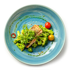 Wall Mural - Grilled salmon fillet with lemon and fresh vegetables on a blue plate