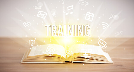 Opeen book with TRAINING inscription, business concept