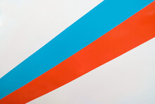 Red And Blue Stripes On A White Surface. Diagonal Perspective View.