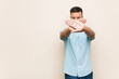 © Asier - Young south-asian man doing a denial gesture
