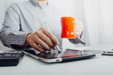 businesswoman hand using smart phone,mobile p payments online shopping,omni channel,digital tablet docking keyboard computer at office in sun light