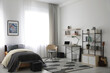 © New Africa - Modern teenager's room interior with workplace and bed
