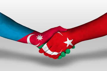 Wall Mural - Handshake between turkey and azerbaijan flags painted on hands, illustration with clipping path.