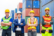© JU.STOCKER - Success Teamwork Concept, Business people engineer and worker team standing with arms crossed as sign of success blurred container box background