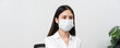 © sitthiphong - Asian business woman wear medical mask and sitting on the table at office, Protection against viruses from outside.