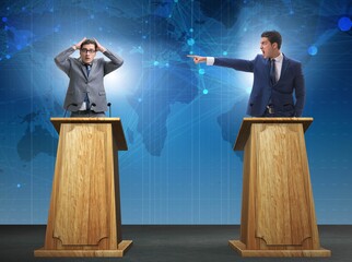 Wall Mural - Two businessmen having heated discussion at panel discussion
