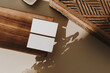© Floral Deco - Blank paper sheet cards with mockup copy space, wooden tray, casket and dry flowers with sunlight shadow on beige background. Minimal business brand template. Flat lay, top view