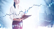 © ImageFlow - Woman with clipboard in city, graph