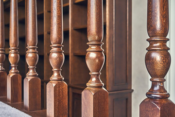 Wall Mural - Wooden balustrade of classic staircase in modern house. Close-up