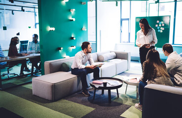 Wall Mural - Work partners having conversation in modern hall of workplace