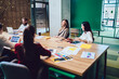 © BullRun - Group of young workers meeting at design office