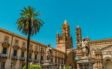 Wall Mural - The beautiful Arab Norman Cathedral in Palermo, Sicily, Italy with palm tree