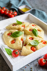 Wall Mural - Sliced Focaccia bread with tomatoes and basil