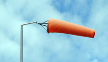 Orange Fabric Wind Sock On Metal Pole 
