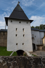 Wall Mural - Tower of the Lower Lattices with fortress wall of Holy Dormition Pskovo-Pechersky Monastery. Pechory, Russia