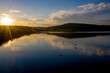 © volody10 - aerial view of fisherman at the boat on golden sunset river. silhouette of fishermen with his boat, Fisherman life style