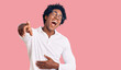 © Krakenimages.com - Handsome african american man with afro hair wearing casual clothes and glasses laughing at you, pointing finger to the camera with hand over body, shame expression