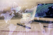 © peshkova - Double exposure of financial graph drawings and desk with open notebook background. Concept of forex market