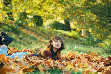 Wall Mural - Healthy and natural woman beauty. Nice sunny weather. Fall portrait of happy young woman in forest in fall colors. Dreamy beautiful girl on autumn background with colorful leaves.