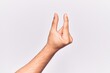 © Krakenimages.com - Close up of hand of young caucasian man over isolated background picking and taking invisible thing, holding object with fingers showing space