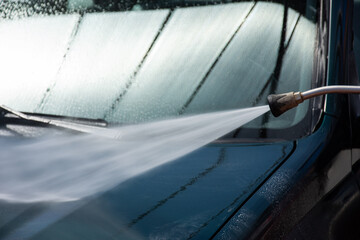 High-pressure washing car outdoors