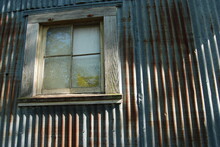Rusted Barn With Wood Framed Window Rural Building With Copy Space Rustic Feel Home Improvement Concept Old Worn Down Building On Farm Rusted Steel Wall Shabby Close Up Window 
