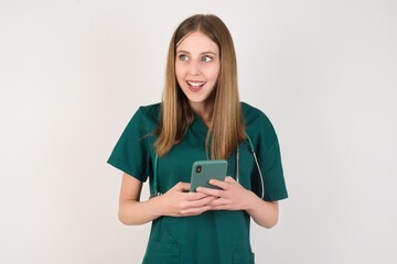 Copyspace photo of Female doctor wearing a green scrubs and stethoscope pretty attractive gorgeous sweet lovely beautiful girlfriend stupor with something occurring in social media