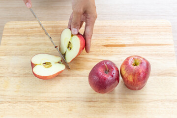 Sticker - Apples and slices on wooden cutting board.