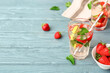 © Pixel-Shot - Glass of tasty strawberry mojito on table