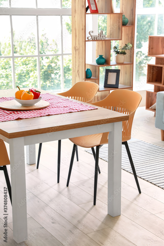 Dining table in interior of modern room