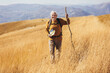 © Mediteraneo - Senior man on hike through beautiful countryside in autumn.