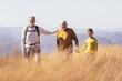 © Mediteraneo - Three generations of family hiking together in the autumn.