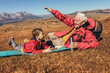 © Mediteraneo - Boy camping with grandfather in autumn, having fun.