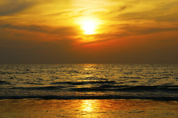 Wall Mural - dramatic clouds. Sunset on a tropical island combined with sea and clouds in a dramatic sky