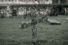Old Skewed And Tilted Wooden Cross At An Old Cemetery In Sweden